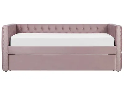 A pink velvet daybed with a trundle drawer is shown from the front against a white background.