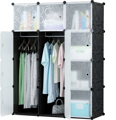 A modular wardrobe with clothes hanging inside and shelves visible.