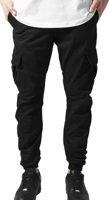 A person wearing black cargo jogging pants and black sneakers, shown from the waist down.