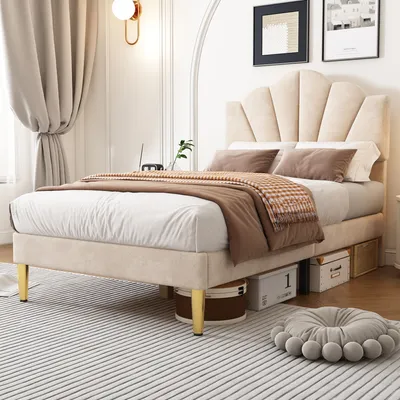 A bedroom scene with a bed, curtains, and wall decor.