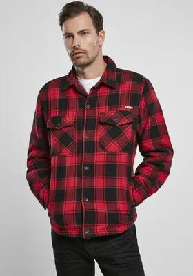 A man wearing a red and black plaid jacket.