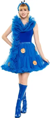 A woman dressed as the Cookie Monster from Sesame Street, posing against a white background.