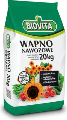 A bag of fertilizer with images of vegetables and flowers.