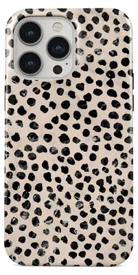 A close-up view of a phone case with a dalmatian-like pattern.