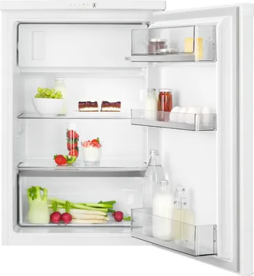 An open refrigerator with food items on its shelves.