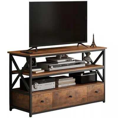 A TV stand with a television and various electronic devices on it.
