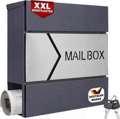 A modern, dark gray mailbox with a silver front panel displaying the word "MAILBOX" and a newspaper compartment at the bottom. It includes two keys and a German brand logo.