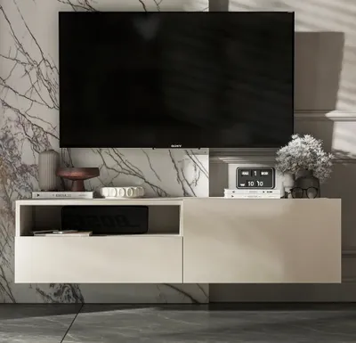 A modern, wall-mounted TV cabinet with a television mounted above it, set against a marble-patterned wall.