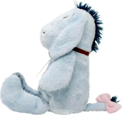 A plush toy Eeyore sitting down, viewed from the side.