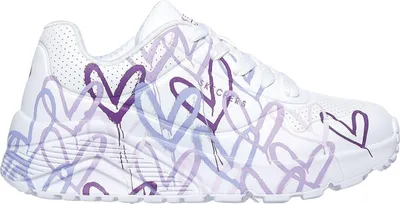 A white sneaker with purple heart graphics.