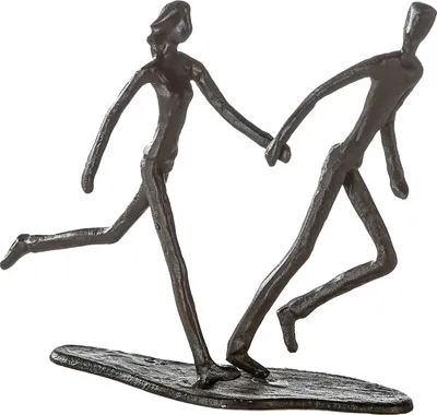 A bronze sculpture of two stick figures running and holding hands.