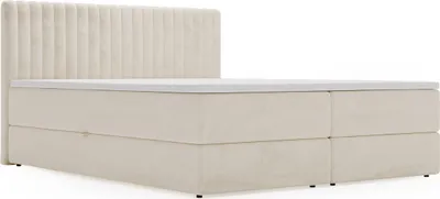 A beige boxspring bed with a headboard is shown against a white background.