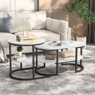 Produktbild von Ineinander schiebbare ovale und runde Couchtische mit weißer Marmoroptik und schwarzem Gestell schaffen ein modernes und elegantes Design.