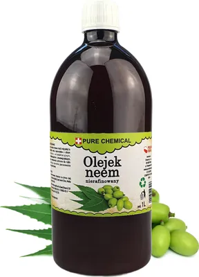 A bottle of neem oil with leaves and fruits of the neem tree.