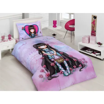 A child's bedroom with a bed made up with a Santoro Gorjuss themed duvet cover and pillow.