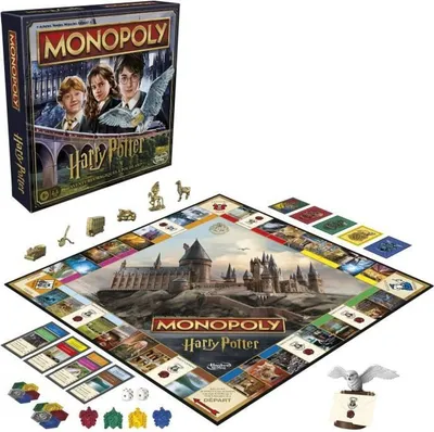 A Monopoly Harry Potter board game set, including the box, board, playing pieces, cards, and dice, displayed on a white background.