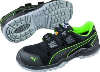 A pair of black Puma safety shoes with green accents, shown from two angles.