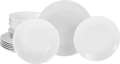 A stack of white ceramic plates and bowls.