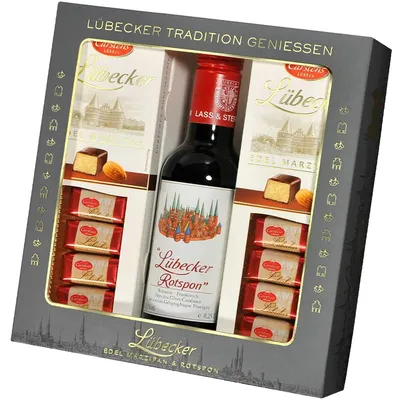 A gift set containing a bottle of red wine and marzipan chocolates, presented in a decorative box.