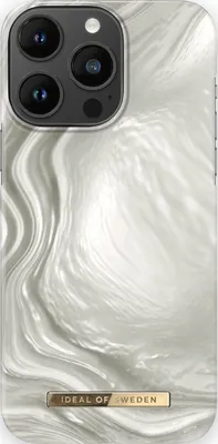 A close-up view of an iPhone 14 Pro Max case with a luminous pearl design.