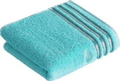 A folded turquoise towel with decorative stripes on a white background.