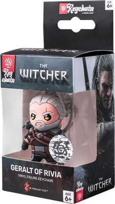 A vinyl figure keychain of Geralt of Rivia from The Witcher, presented in its retail packaging.