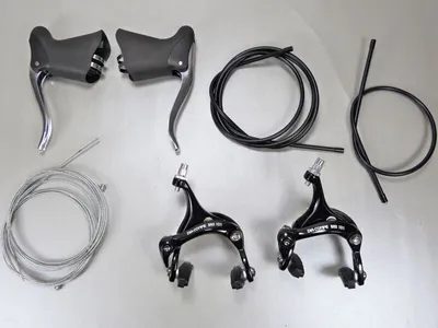 Produktbild von Rennrad Bremsenset Schwarz & Silber - Ergonomisch & Wetterbeständig