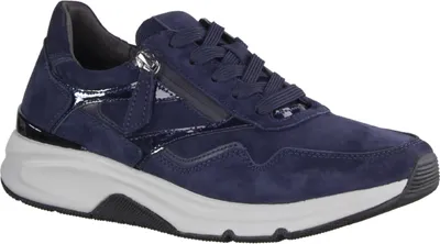 A studio shot of a single blue sneaker.