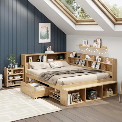 A bedroom with a wooden bed frame, shelves, and drawers, under a sloped ceiling with skylights.