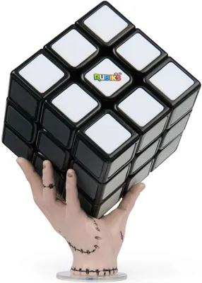 A Rubik's cube is held by a stylized hand.