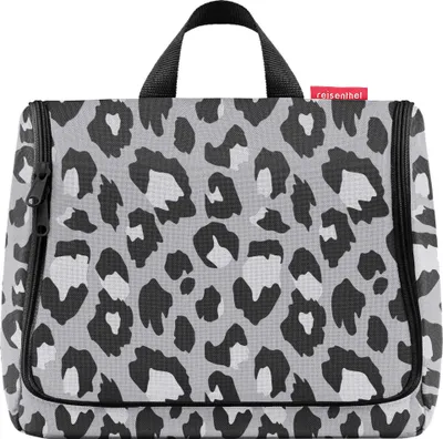A close-up of a leopard-print toiletry bag.