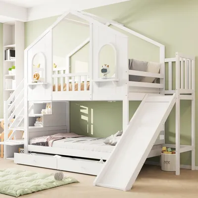A white bunk bed with a slide and stairs, designed for children, in a room with light green walls.