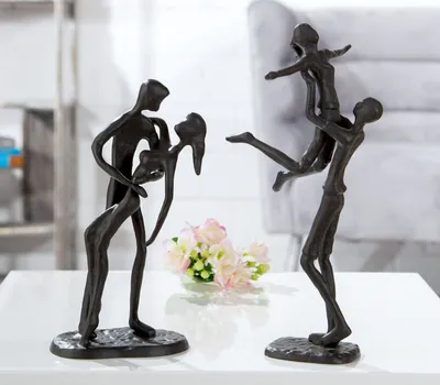Produktbild von Große 24 cm hohe Design Figur, Skulptur mit Umsetzungsmotto, HEBEFIGUR, aus Eisen BRÜNIERT, durch kunstvollen Stil in Szene gesetzt, Größe 24 x 15 x 12 cm, tolle kreative Geschenkidee
