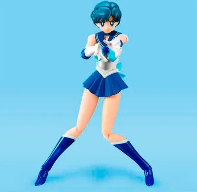 A Sailor Moon action figure against a plain blue background.