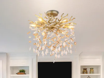 A gold-colored chandelier with crystal accents hanging from a white ceiling.