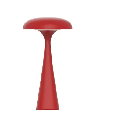 A red mushroom-shaped table lamp is shown against a white background.