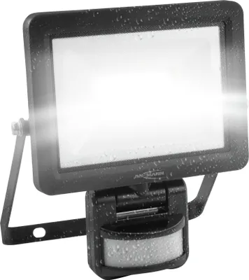 A black LED floodlight with a motion sensor, shown against a white background. The product has water droplets on its surface, suggesting it is weatherproof.