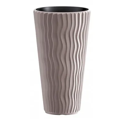 A tall, textured planter pot with a wavy design.