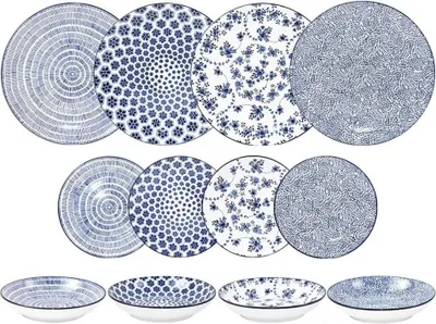 A collection of blue and white patterned plates and bowls arranged in rows.