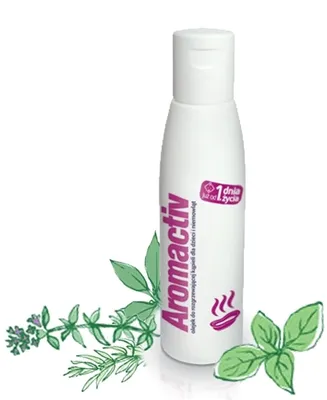 A bottle of Aromactiv bath oil for children, with sprigs of herbs on either side.