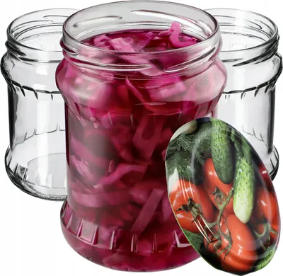 Three glass jars, one filled with red cabbage, and a decorative lid with tomatoes and cucumbers.
