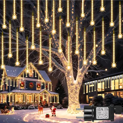 A festive winter scene with a decorated house and tree illuminated by string lights.
