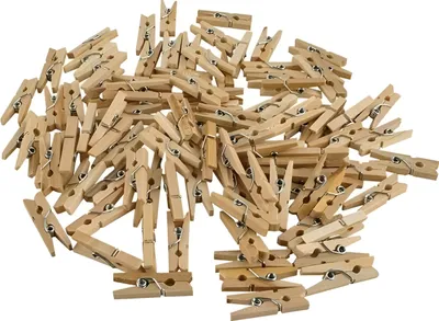 A pile of small wooden clothespins.