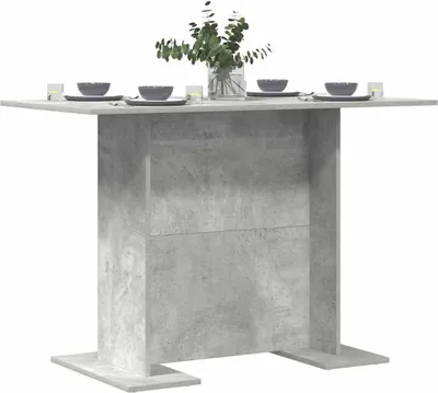 A dining table set up with bowls and glasses.