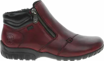 A side view of a red Rieker boot.