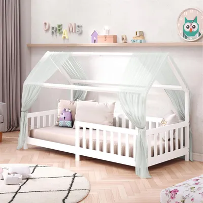 A child's bedroom with a white house-shaped bed with a light green canopy.