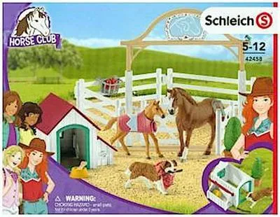 A toy playset featuring horses, a dog, figures, and accessories, presented in its retail packaging.