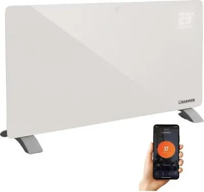 A white glass convector heater with a smartphone displaying a heating app in the foreground.