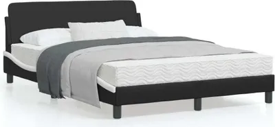 A black bed frame with a mattress and bedding, shown against a white background.