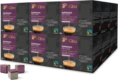 A stack of Tchibo Qbo Espresso Oro Tolima coffee capsule boxes, with three individual capsules in the foreground.